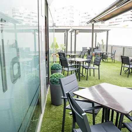 Sercotel Aura Отель